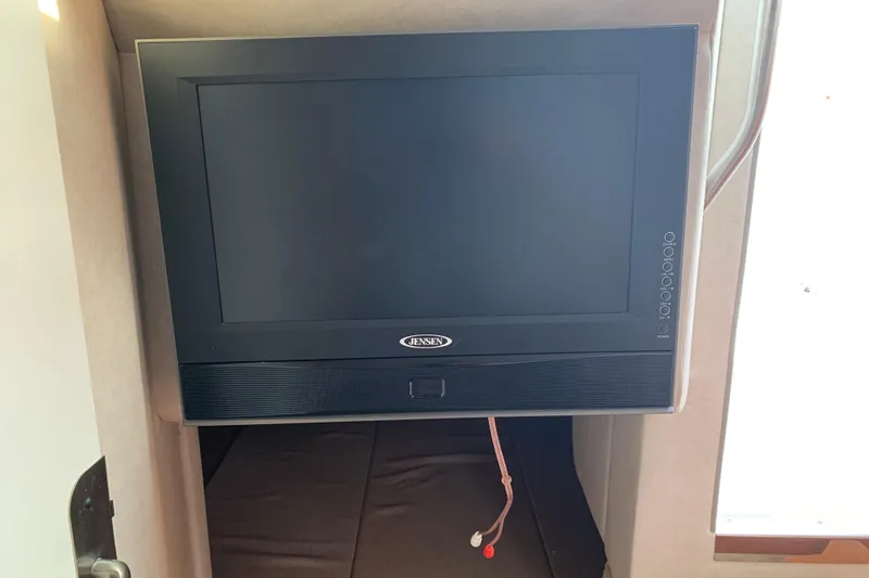 Slide: The Image of Jensen TV inside 2010 Sea Ray 260 Sundancer boat cabin. - 49