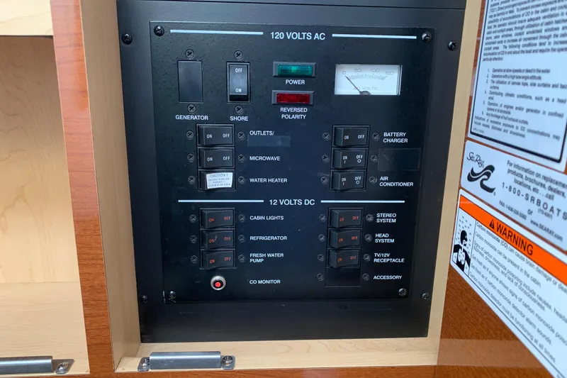 Slide: The Image of Electrical control panel on a 2010 Sea Ray 260 Sundancer boat. - 53