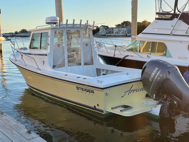 Slide: The Image of 2021 Steiger Craft 23DV Miami boat docked with Yamaha outboard motor. - 0