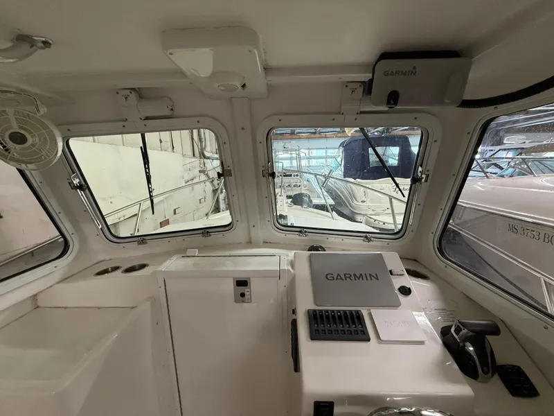 Slide: The Image of Interior view of 2021 Steiger Craft 23DV Miami boat with Garmin navigation system. - 12