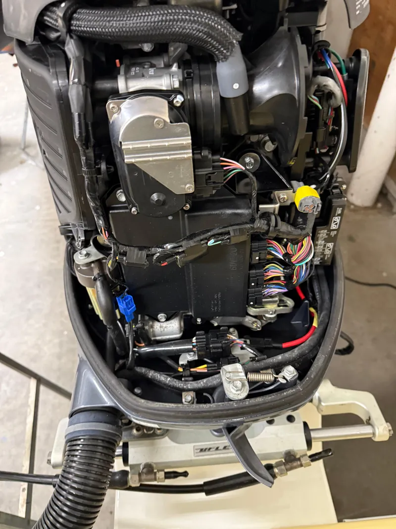 Slide: The Image of Close-up of a 2021 Steiger Craft 23DV Miami boat engine with visible wiring and components. - 18