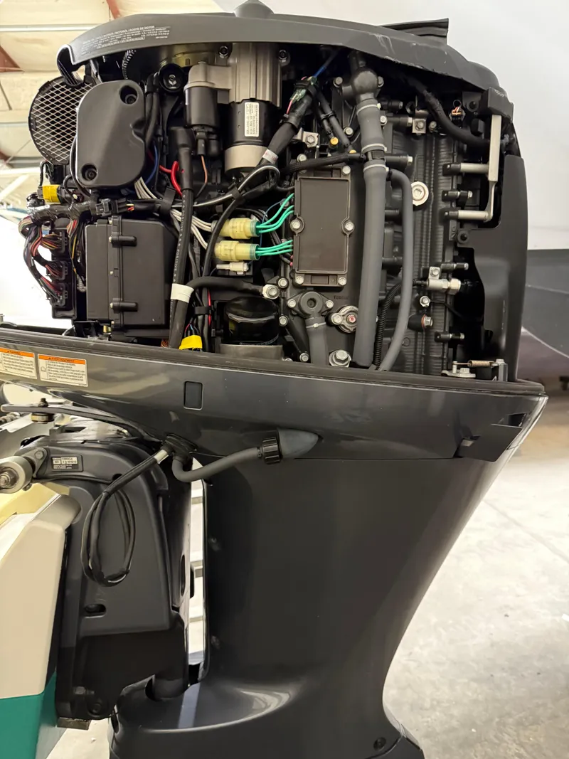 Slide: The Image of Close-up of a 2021 Steiger Craft 23DV Miami outboard motor, showcasing internal components. - 19