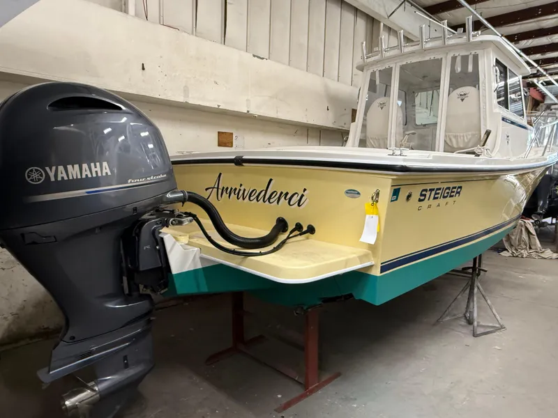 Slide: The Image of 2021 Steiger Craft 23DV Miami boat with Yamaha engine in a garage. - 4