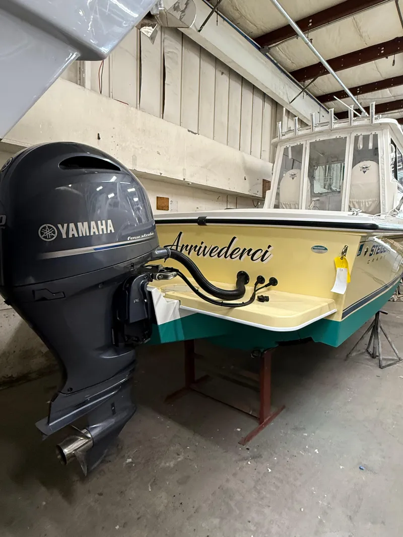Slide: The Image of 2021 Steiger Craft 23DV Miami boat with Yamaha engine in a workshop. - 5