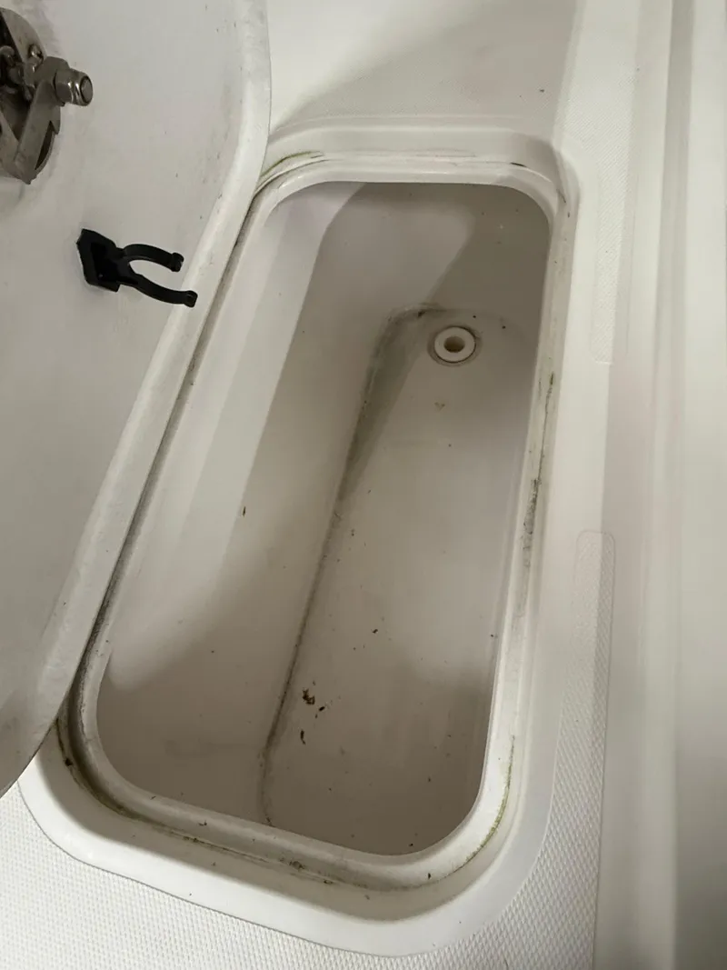 Slide: The Image of Open storage compartment on 2021 Steiger Craft 23DV Miami boat. - 9