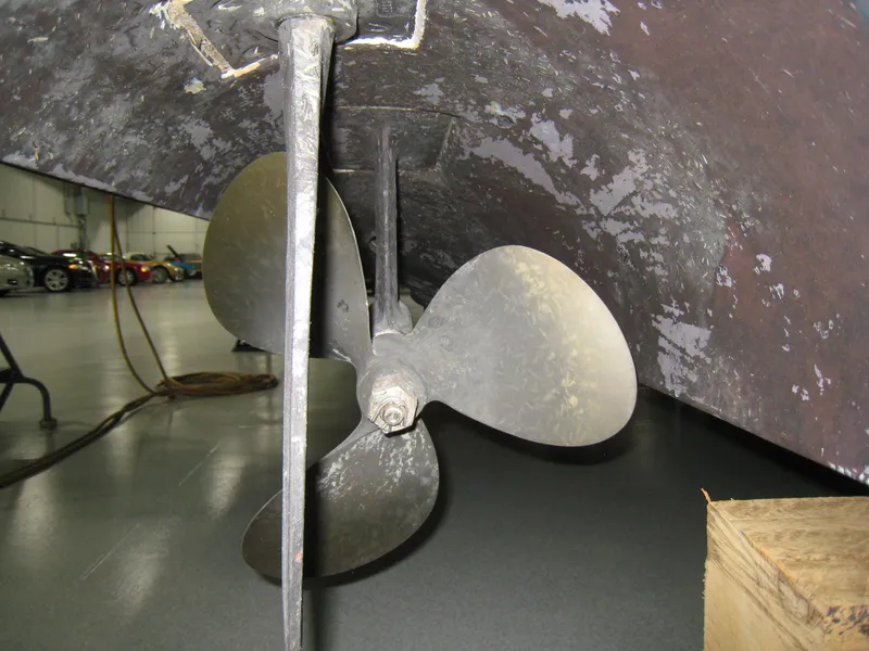 Slide: The Image of Propeller of 1986 Sea Ray 340 Express Cruiser in a garage setting. - 18