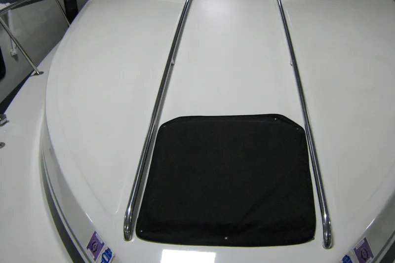 Slide: The Image of 1986 Sea Ray 340 Express Cruiser deck with stainless steel rails and black cover. - 5