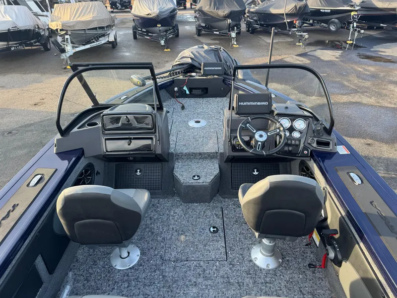 Slide: The Image of 2024 Tracker Targa V-19 WT boat interior with dual seats and steering console. - 15