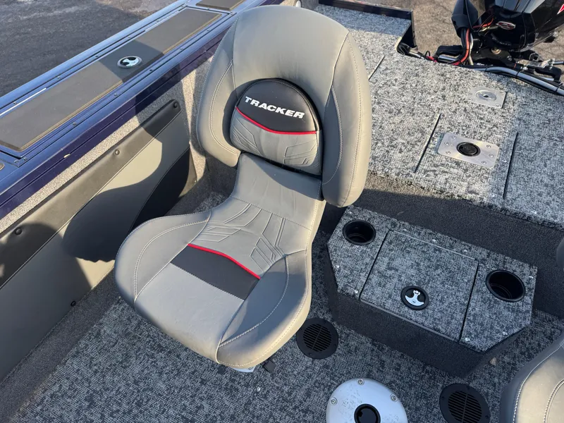 Slide: The Image of 2024 Tracker Targa V-19 WT boat seat with gray upholstery and red accents. - 7