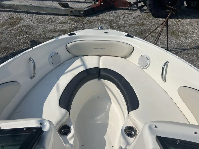 Slide: The Image of 2012 Sea Ray 205 Sport boat interior with seating and speakers. - 3