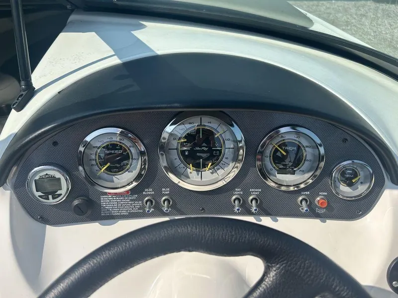 Slide: The Image of Dashboard of a 2012 Sea Ray 205 Sport boat with gauges and controls. - 4