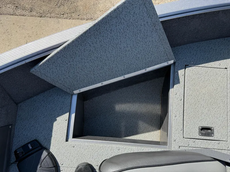 Slide: The Image of 2017 Lund 1650 Rebel XS SS boat with open storage compartment. - 12