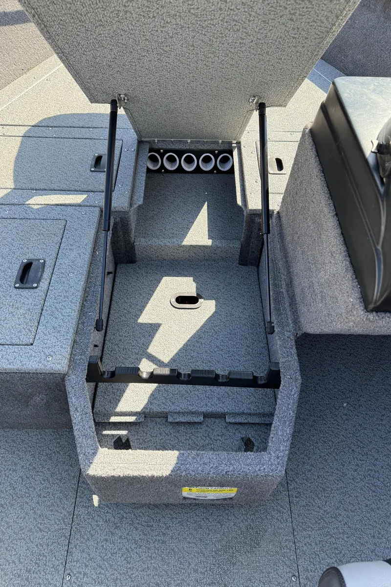 Slide: The Image of 2017 Lund 1650 Rebel XS SS boat interior with open storage compartment. - 15