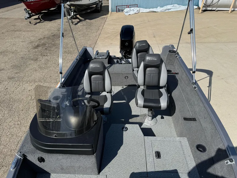 Slide: The Image of 2017 Lund 1650 Rebel XS SS boat interior with seating and steering console. - 16