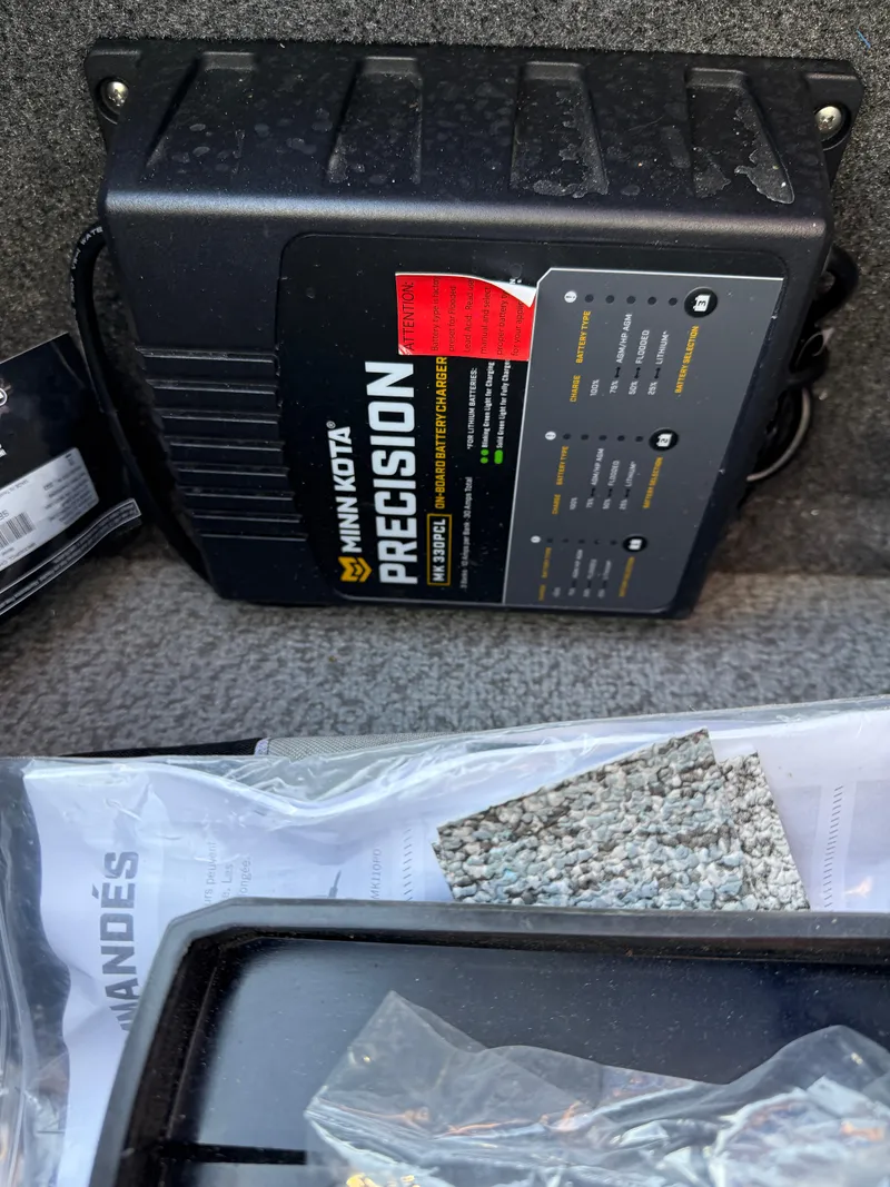 Slide: The Image of Minn Kota Precision charger in a 2017 Lund 1650 Rebel XS SS boat. - 19