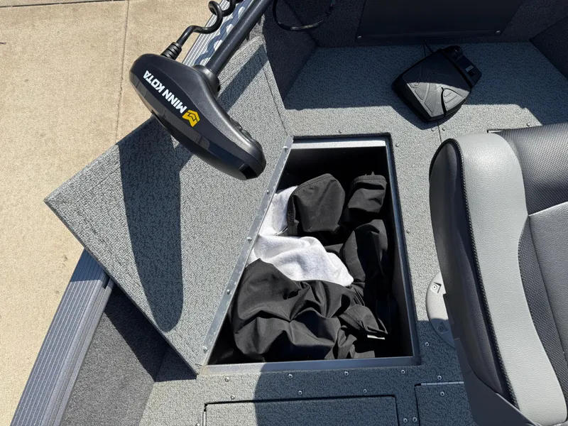 Slide: The Image of Storage compartment in 2017 Lund 1650 Rebel XS SS boat with Minn Kota trolling motor. - 20