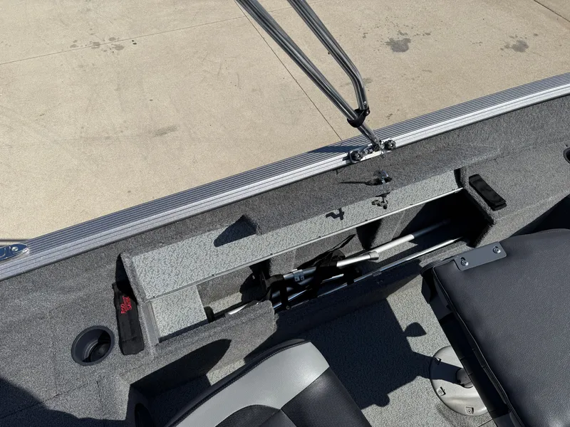 Slide: The Image of 2017 Lund 1650 Rebel XS SS boat interior with storage compartment and seating. - 24