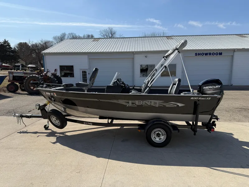 Slide: The Image of 2017 Lund 1650 Rebel XS SS boat on trailer outside showroom. - 3