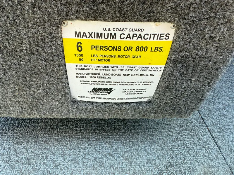 Slide: The Image of U.S. Coast Guard capacity label for 2017 Lund 1650 Rebel XS SS boat, 6 persons or 800 lbs. - 31