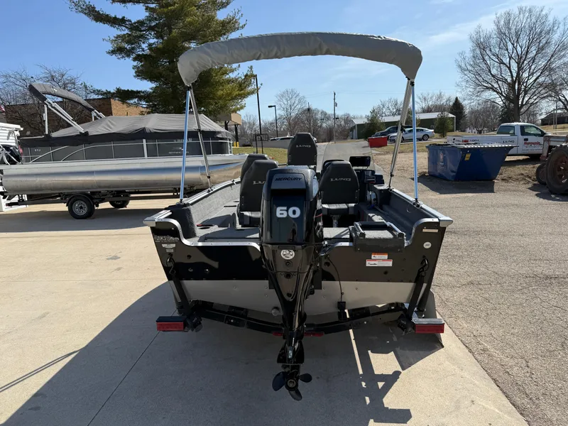 Slide: The Image of 2017 Lund 1650 Rebel XS SS boat with 60 HP engine, parked outdoors. - 5