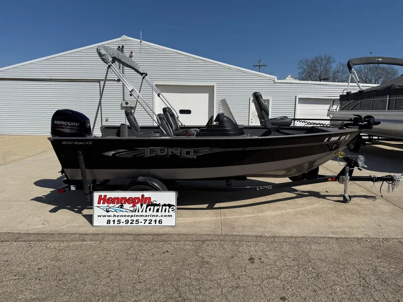 Slide: The Image of 2017 Lund 1650 Rebel XS SS boat on trailer at Hennepin Marine dealership. - 7