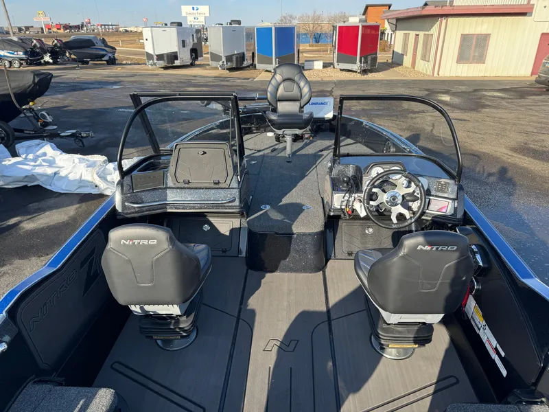 Slide: The Image of 2024 Nitro ZV21 Pro boat interior with dual seats and steering console. - 16