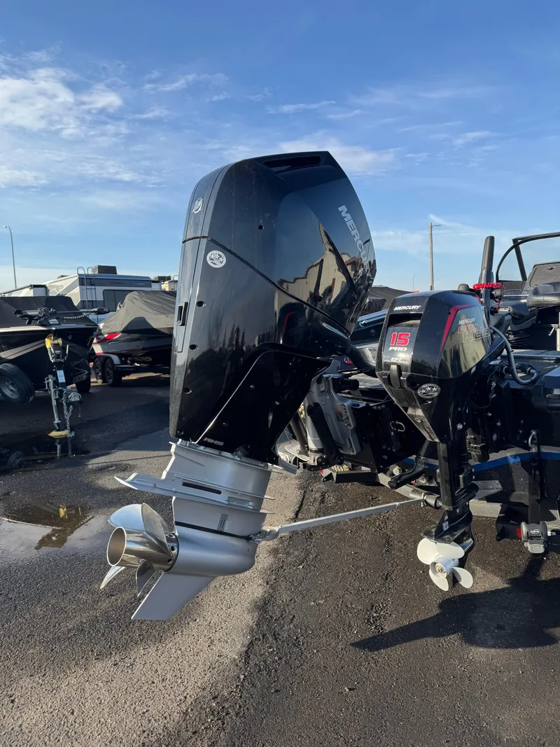 Slide: The Image of 2024 Nitro ZV21 Pro outboard motor, sleek design, parked outdoors. - 3