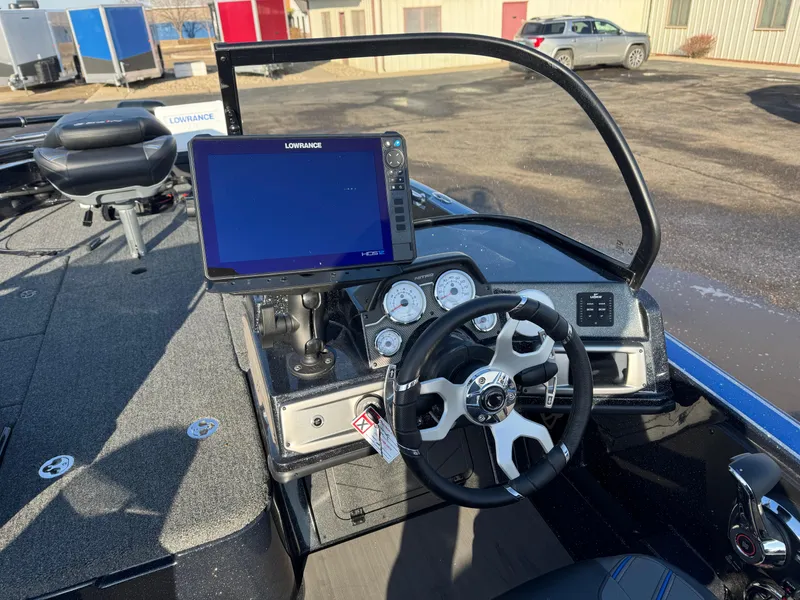 Slide: The Image of 2024 Nitro ZV21 Pro boat dashboard with steering wheel and navigation display. - 9