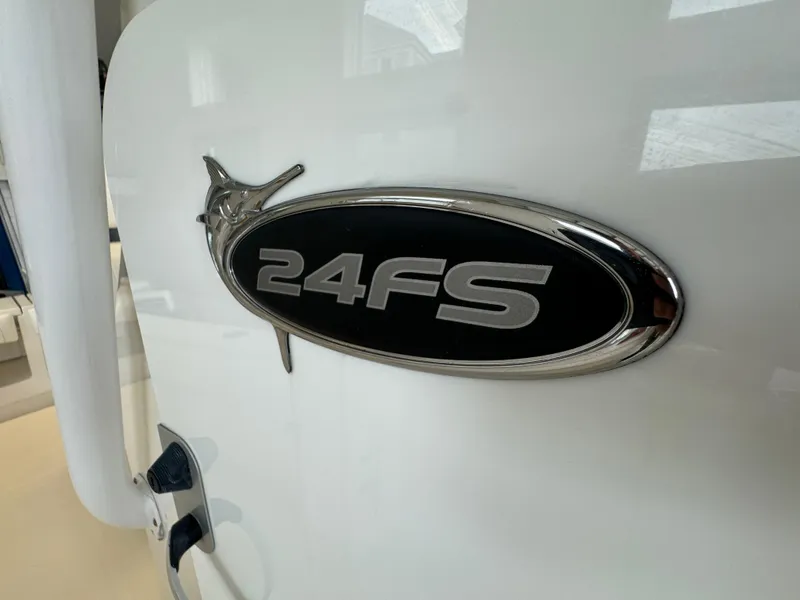 Slide: The Image of 2012 Regulator 24 Forward Seating boat emblem close-up. - 15