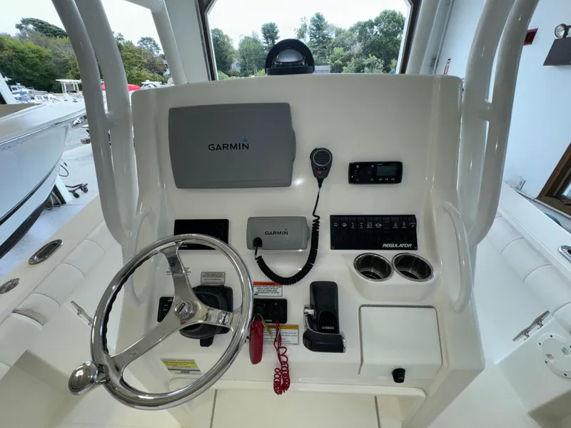 Slide: The Image of 2012 Regulator 24 Forward Seating boat dashboard with Garmin navigation system. - 20