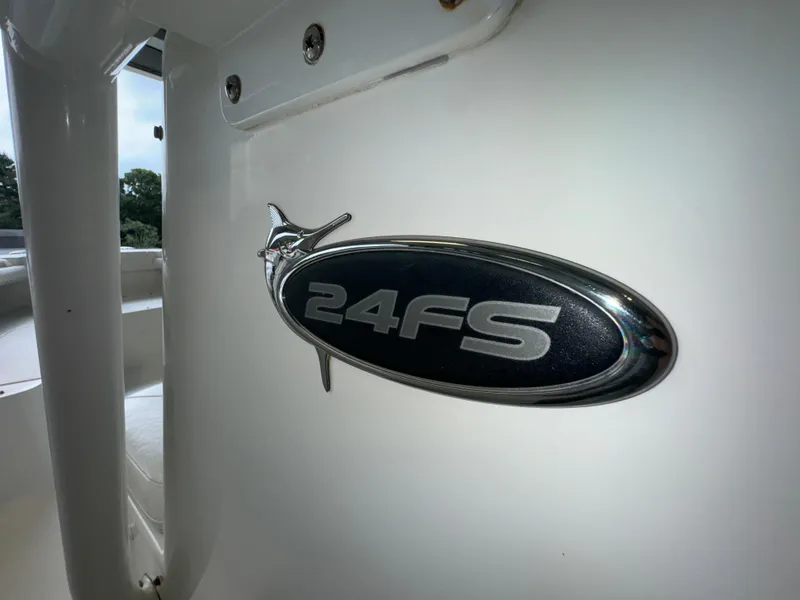 Slide: The Image of 2012 Regulator 24 Forward Seating boat emblem detail. - 23