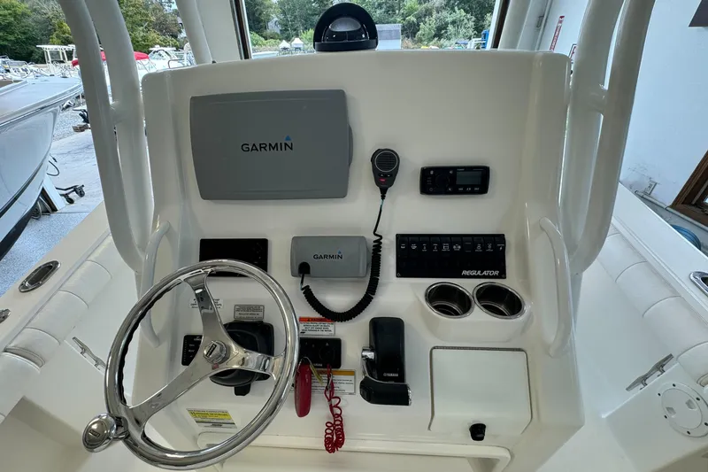 Slide: The Image of 2012 Regulator 24 Forward Seating boat dashboard with Garmin navigation system. - 24