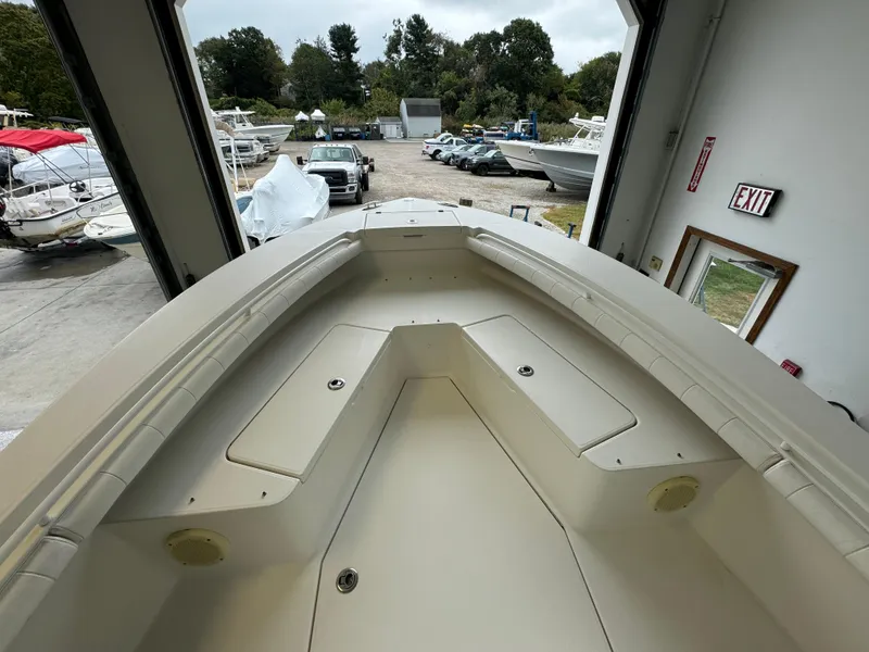 Slide: The Image of 2012 Regulator 24 Forward Seating boat in a storage facility. - 5