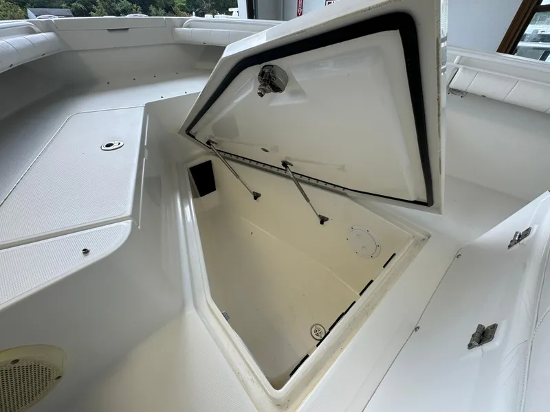 Slide: The Image of 2012 Regulator 24 Forward Seating boat storage compartment open. - 7