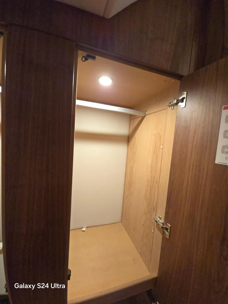 Slide: The Image of Interior wooden cabinet in 2022 Riviera 54 Enclosed Flybridge yacht. - 34