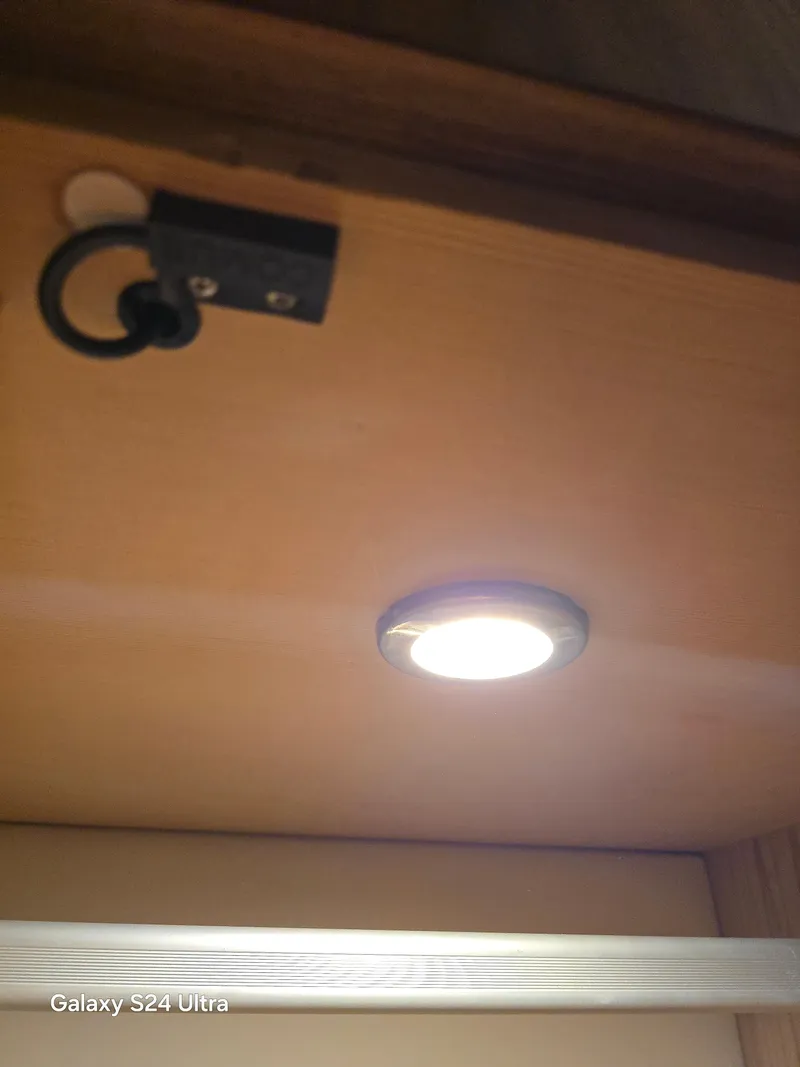 Slide: The Image of LED light fixture in 2022 Riviera 54 Enclosed Flybridge interior. - 37