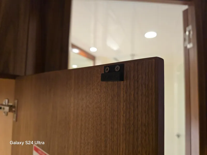 Slide: The Image of Wooden door detail on 2022 Riviera 54 Enclosed Flybridge yacht interior. - 38