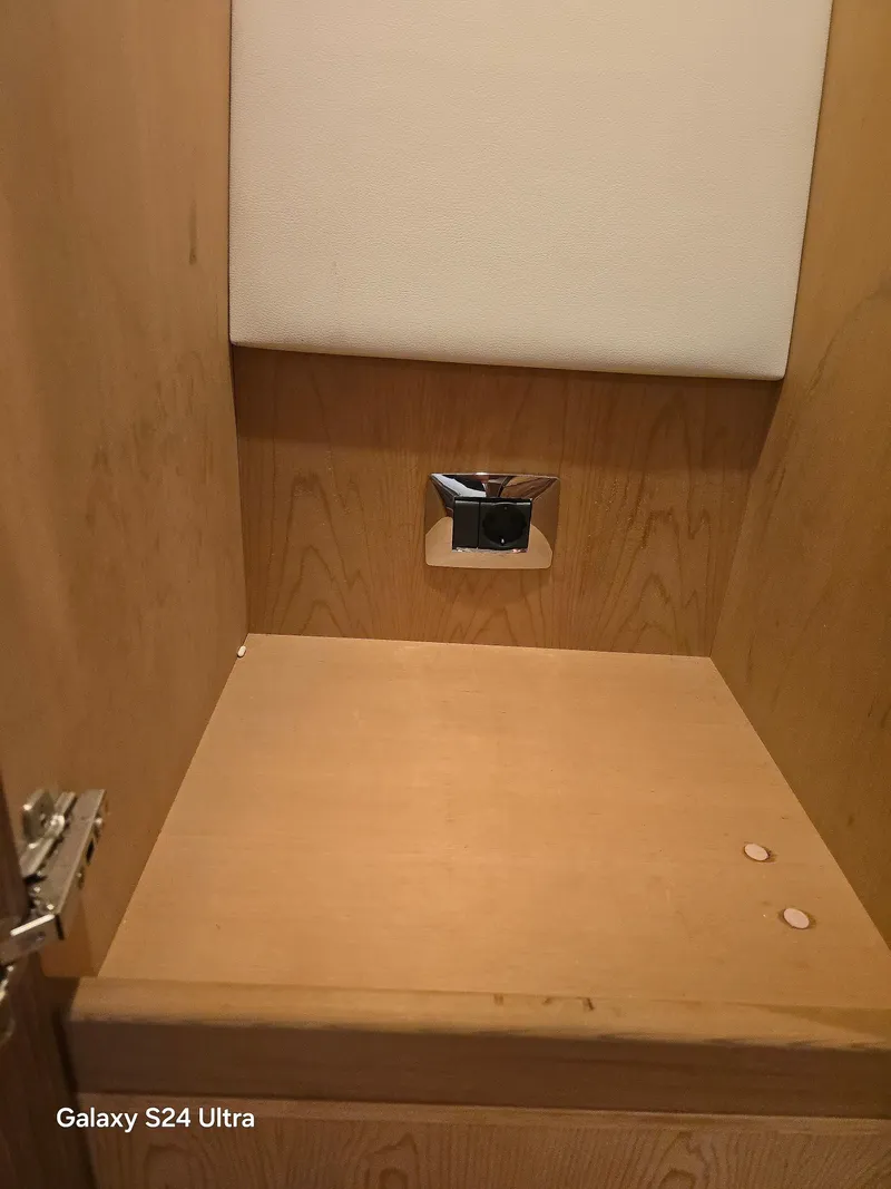 Slide: The Image of Wooden cabinet interior on a 2022 Riviera 54 Enclosed Flybridge yacht. - 39