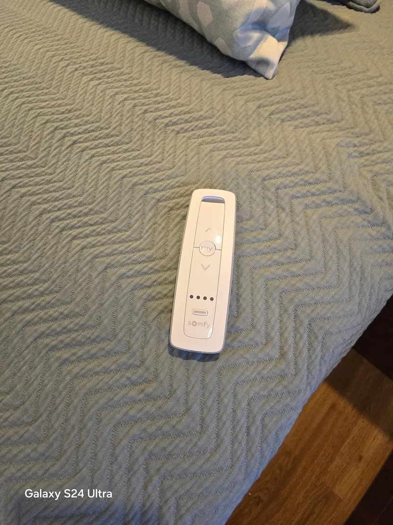 Slide: The Image of Remote control on a textured blue bedspread, Galaxy S24 Ultra photo. - 47