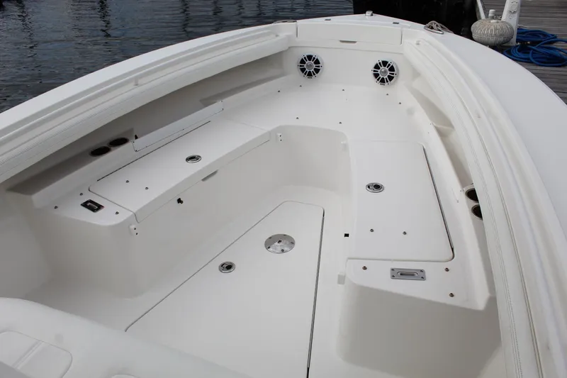 Slide: The Image of 2021 Regulator 23 FS boat interior with spacious seating and storage compartments. - 11