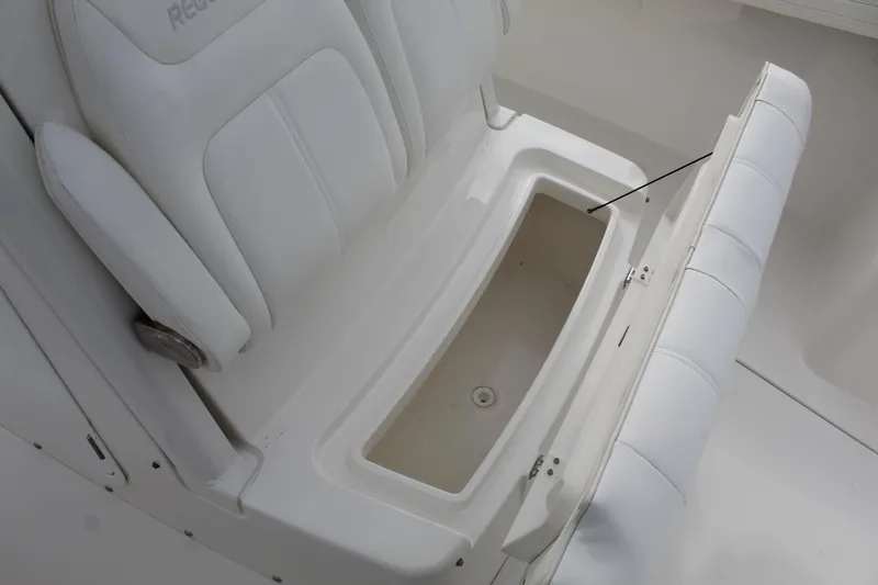 Slide: The Image of 2021 Regulator 23 FS boat seat with open storage compartment. - 7