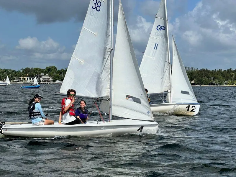 The Image of Sailboats racing on water, featuring 2025 One Design ZIM Club 420 models. - 0