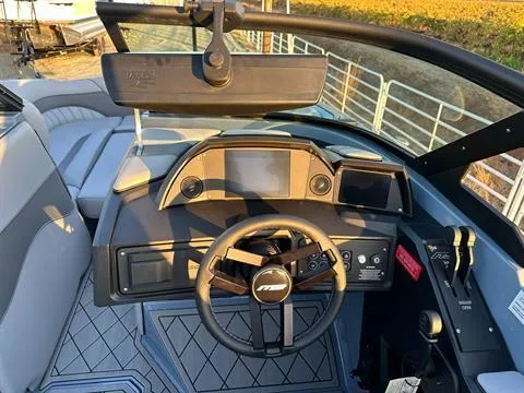 Slide: The Image of 2025 MB B52 25 Alpha boat dashboard with steering wheel and control panel. - 15