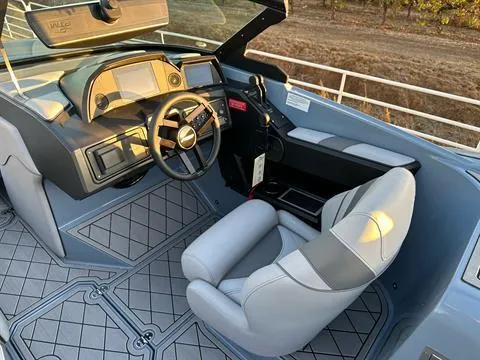 Slide: The Image of 2025 MB B52 25 Alpha boat interior with modern dashboard and comfortable seating. - 17