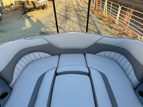 Slide: The Image of 2025 MB B52 25 Alpha boat interior with gray seating and cup holders. - 29