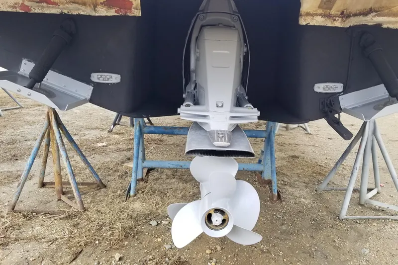 Slide: The Image of 2018 Regal 28 Express boat propeller and stern on stands. - 15