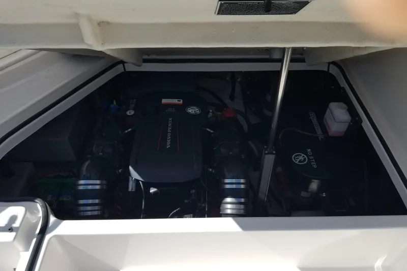 Slide: The Image of Engine compartment of a 2018 Regal 28 Express boat, showcasing mechanical components. - 16