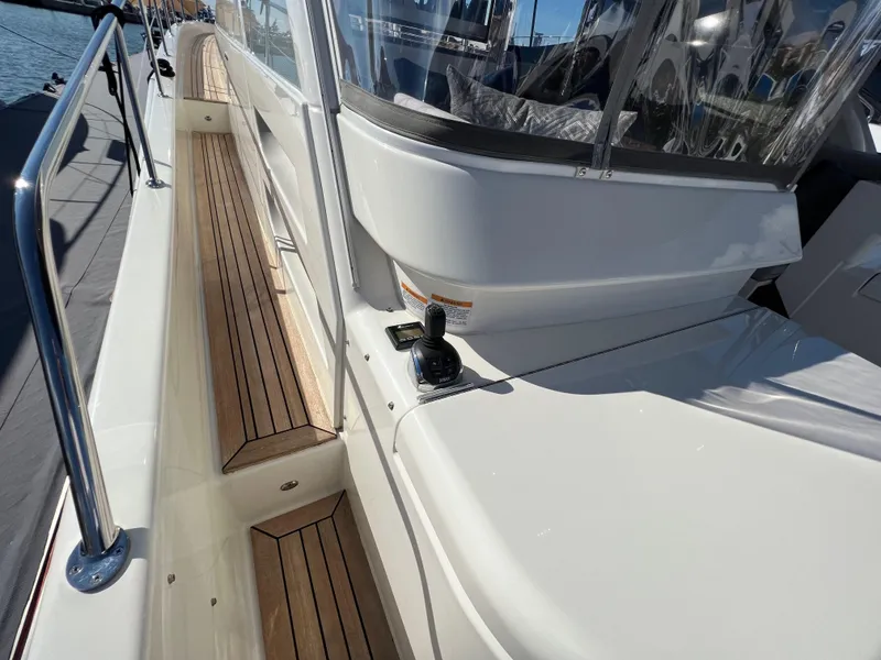 Slide: The Image of 2022 Riviera 505 SUV yacht deck with sleek design and wooden accents. - 46