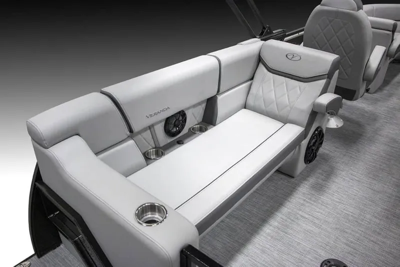 Slide: The Image of Luxurious seating on 2025 Veranda Vertex 22RC boat with cup holders and speakers. - 10