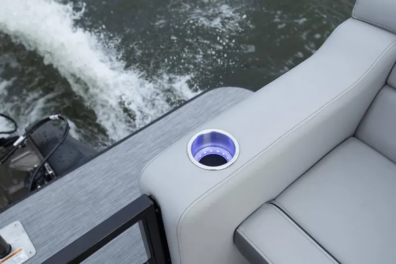 Slide: The Image of 2025 Veranda Vertex 22RC boat interior with cushioned seating and illuminated cup holder. - 5